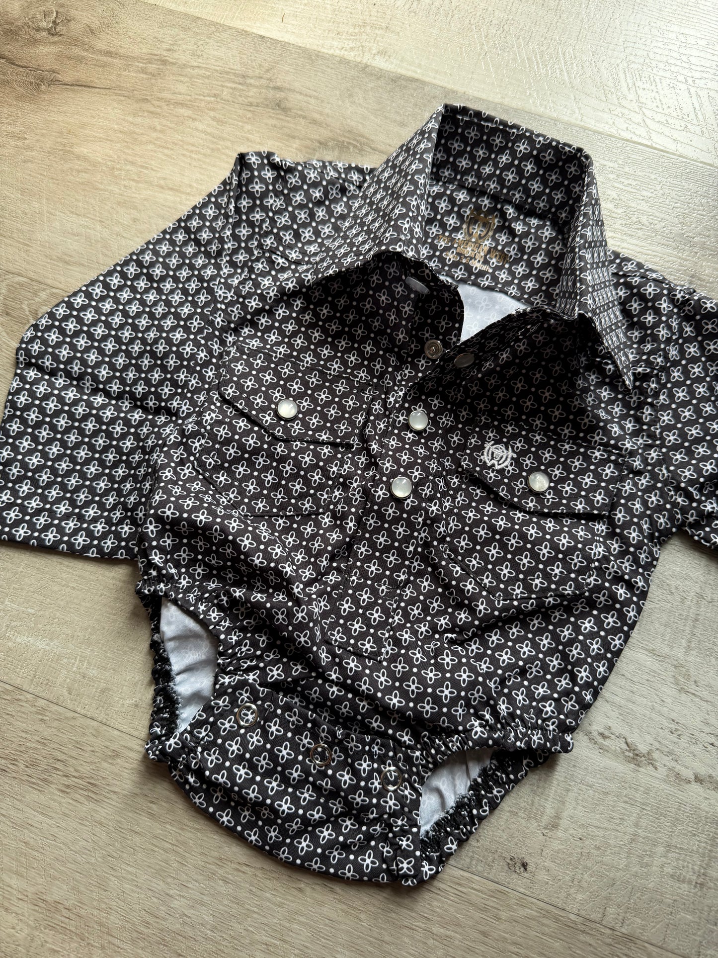 Black & White Pearl Snap Onesie
