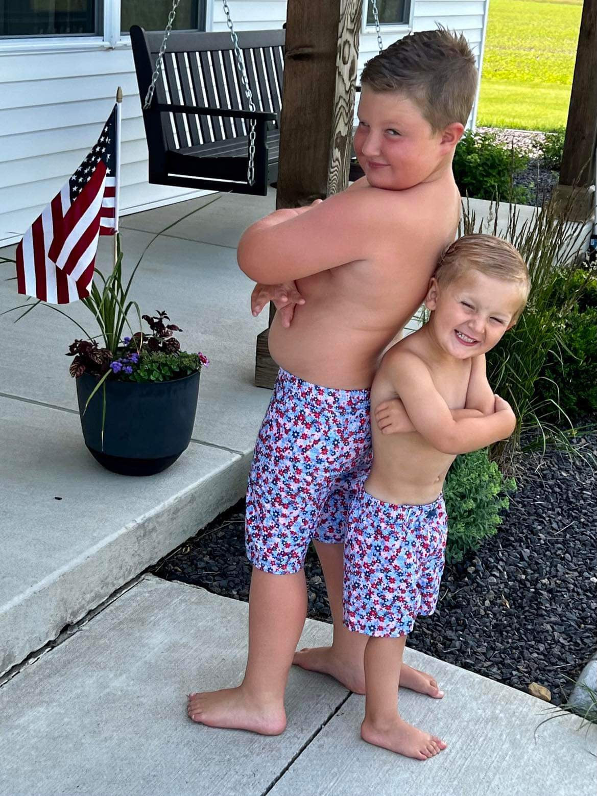 Red, White, & Bloom Swim Trunks